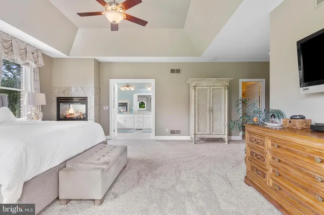 a en suite bathroom with a sink a mirror and a bathtub