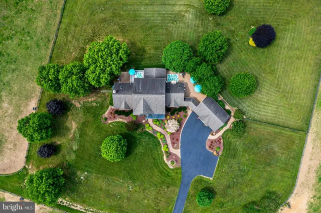 an aerial view of a golf course with a garden