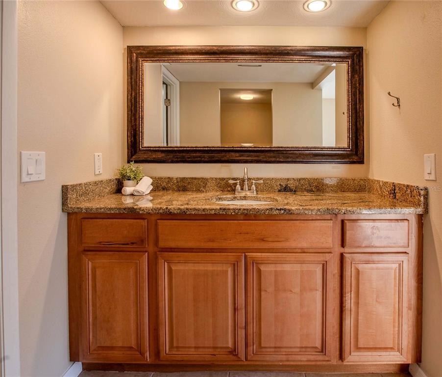 3300 South Beneva Road, Unit 214 Sarasota, FL 34232 - Photo 11 of 22 a bathroom with a sink and a mirror