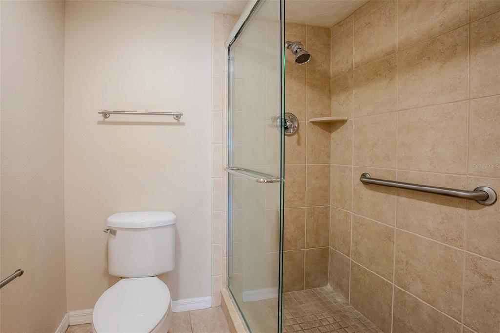 3300 South Beneva Road, Unit 214 Sarasota, FL 34232 - Photo 12 of 22 a bathroom with a toilet and a shower