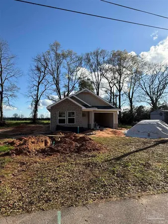 an empty room with wooden floor and white wall