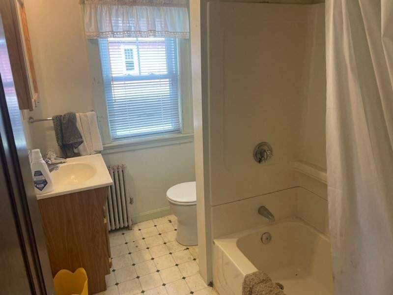 15 Howard Street Wakefield, MA 01880 - Photo 12 of 23 a bathroom with a sink toilet and shower