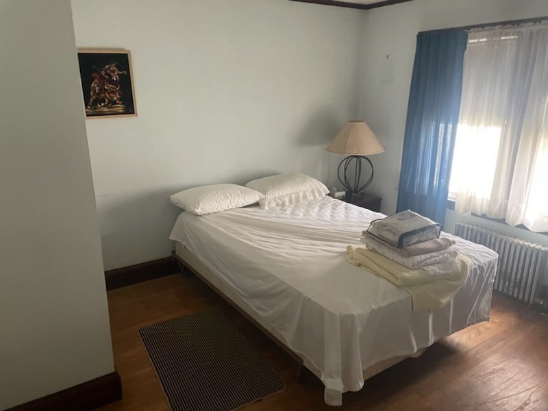 15 Howard Street Wakefield, MA 01880 - Photo 13 of 23 a bedroom with a bed and window