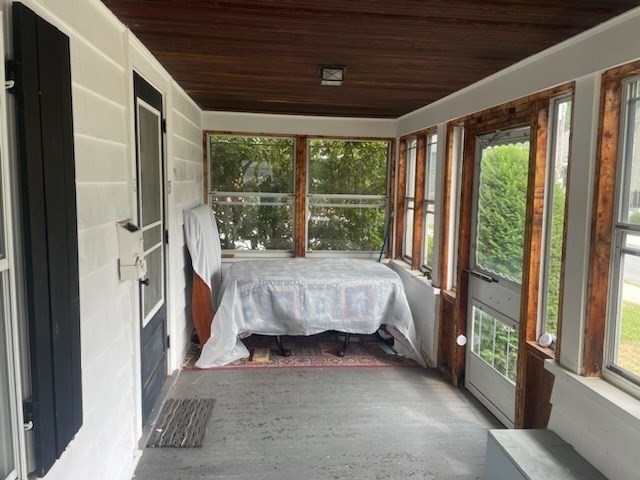 15 Howard Street Wakefield, MA 01880 - Photo 18 of 23 a bed sitting in a room next to a large window