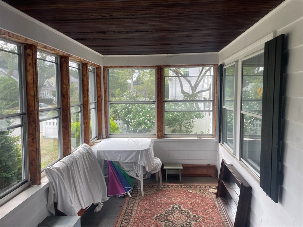 15 Howard Street Wakefield, MA 01880 - Photo 19 of 23 a bed sitting in a bedroom next to a large window