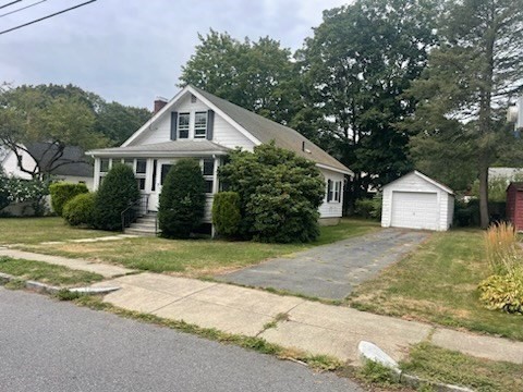 15 Howard Street Wakefield, MA 01880 - Photo 2 of 23 a front view of a house with a yard and trees