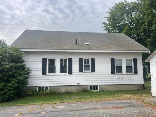 15 Howard Street Wakefield, MA 01880 - Photo 4 of 23 a front view of a house with a garden
