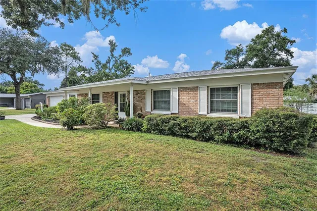 a view of a house with a yard