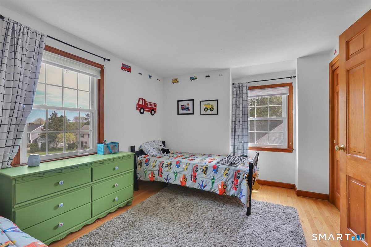 72 Old Post Road Wethersfield, CT 06109 - Photo 24 of 40 a room with baby crib and window