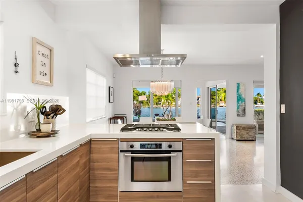 a kitchen with a stove oven and sink