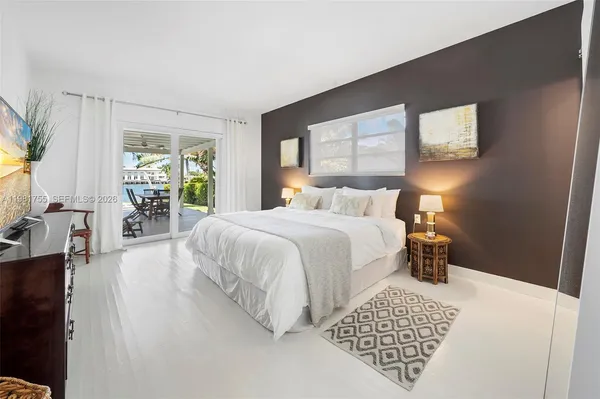 a bedroom with a bed and dresser