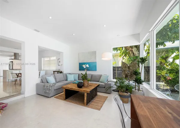 a living room with furniture and a large window