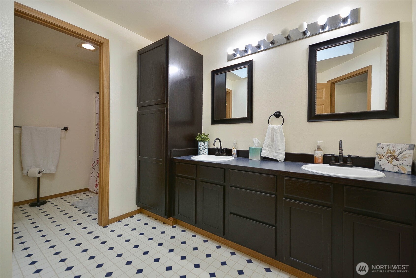 14638 Lawrence Lake Road Southeast Yelm, WA 98597 - Photo 19 of 38 a bathroom with a double vanity sink and mirror