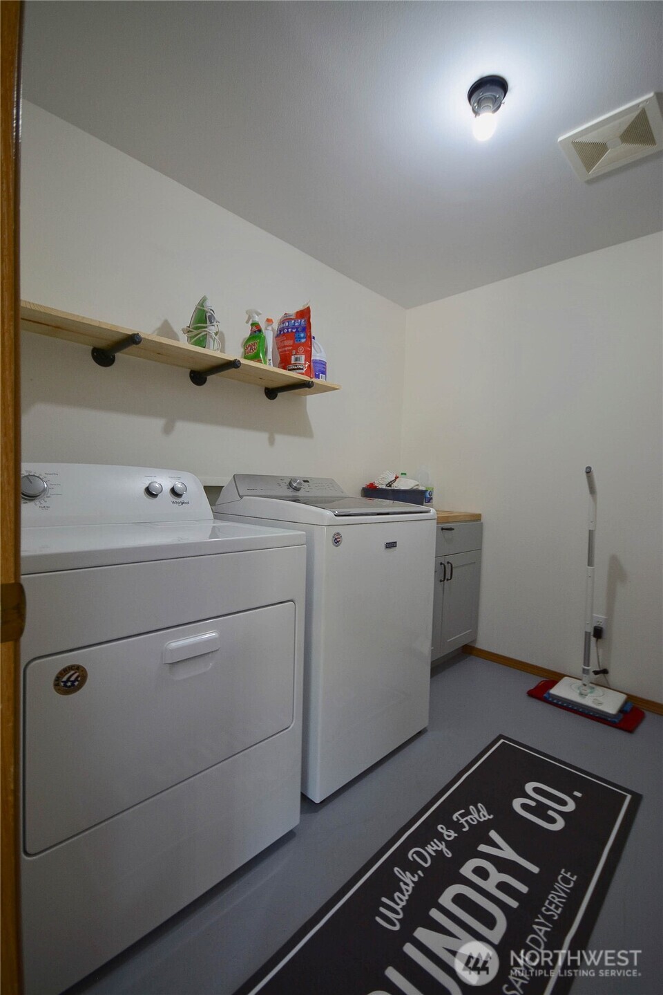 14638 Lawrence Lake Road Southeast Yelm, WA 98597 - Photo 20 of 38 a room with storage and utility