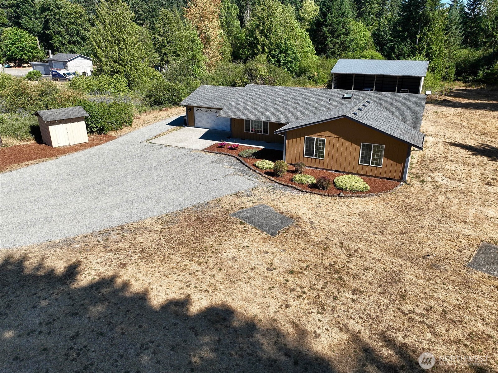14638 Lawrence Lake Road Southeast Yelm, WA 98597 - Photo 21 of 38 a view of a house with a yard