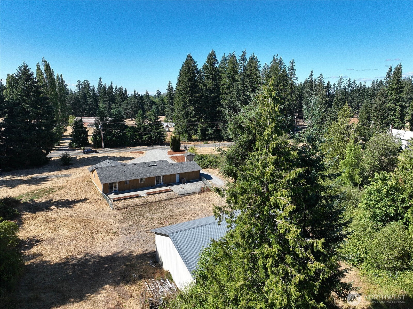 14638 Lawrence Lake Road Southeast Yelm, WA 98597 - Photo 23 of 38 a view of a backyard with sitting area