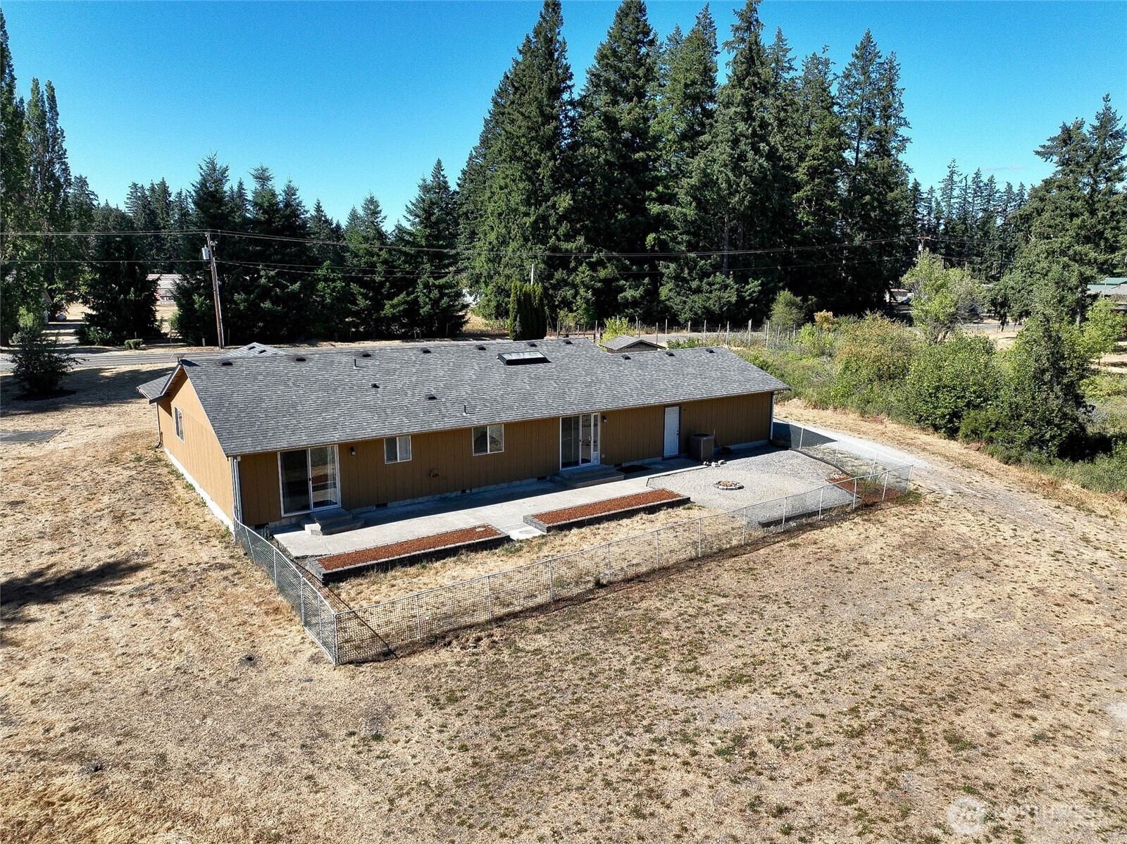 14638 Lawrence Lake Road Southeast Yelm, WA 98597 - Photo 24 of 38 a view of a yard with wooden fence