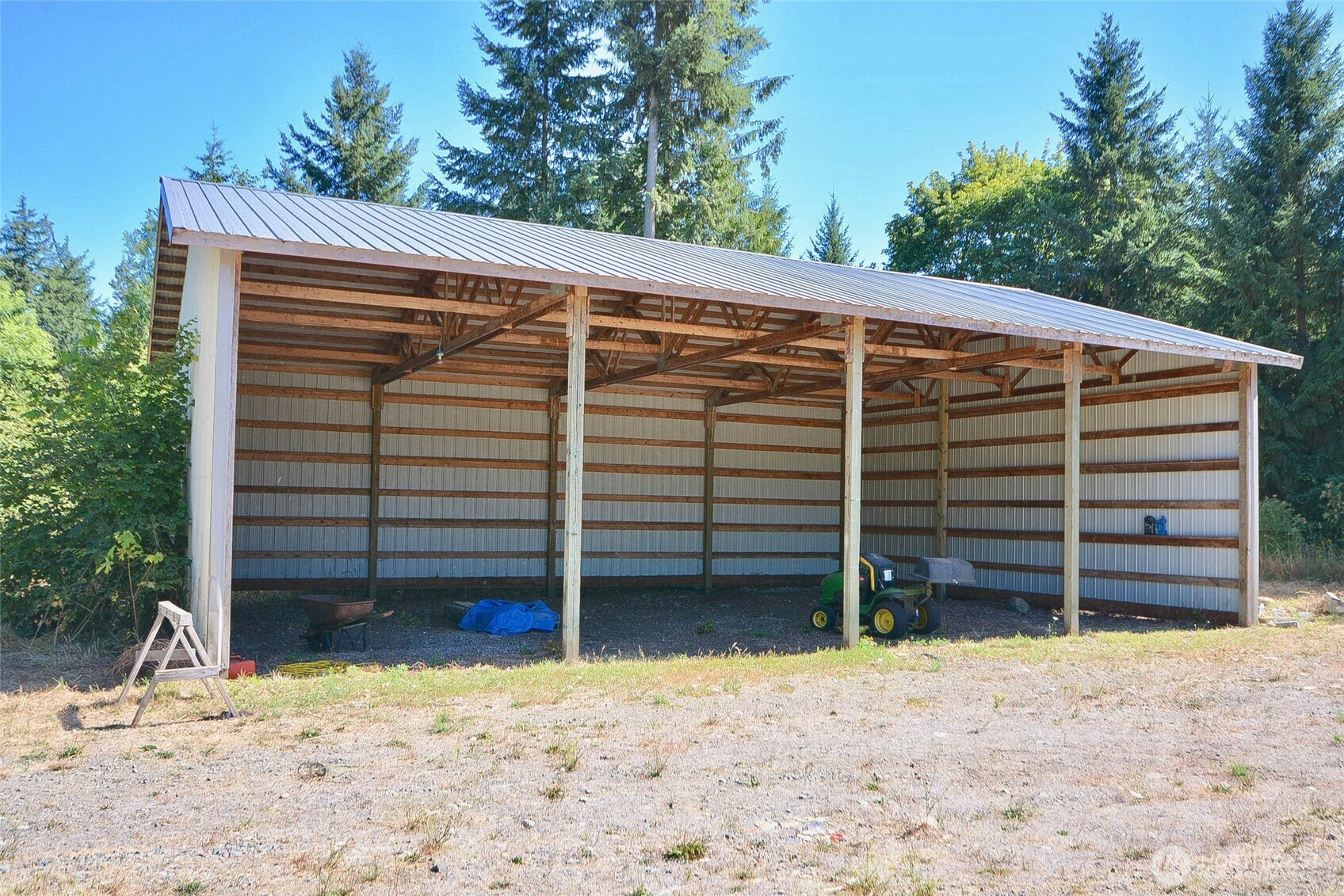 14638 Lawrence Lake Road Southeast Yelm, WA 98597 - Photo 26 of 38 a view of a house with a yard