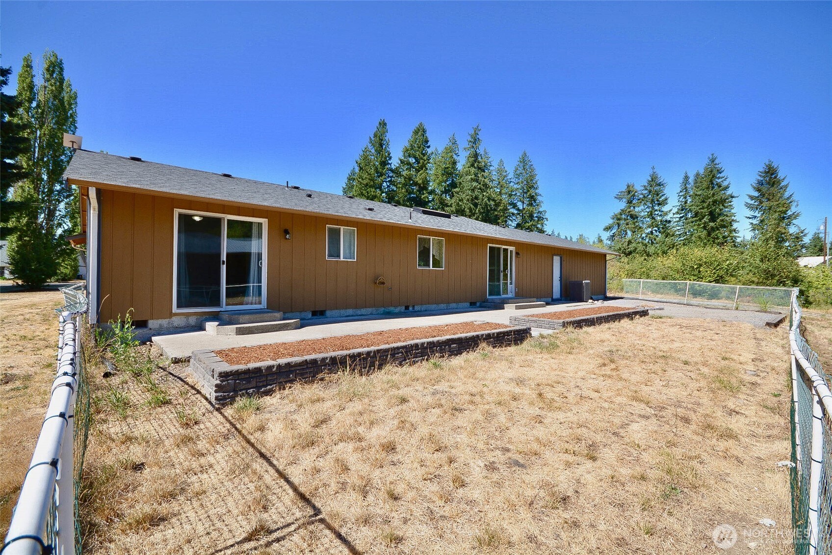 14638 Lawrence Lake Road Southeast Yelm, WA 98597 - Photo 28 of 38 a front view of a house with a yard