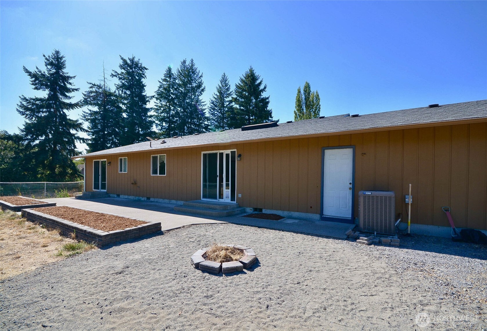 14638 Lawrence Lake Road Southeast Yelm, WA 98597 - Photo 30 of 38 a front view of a house with a yard
