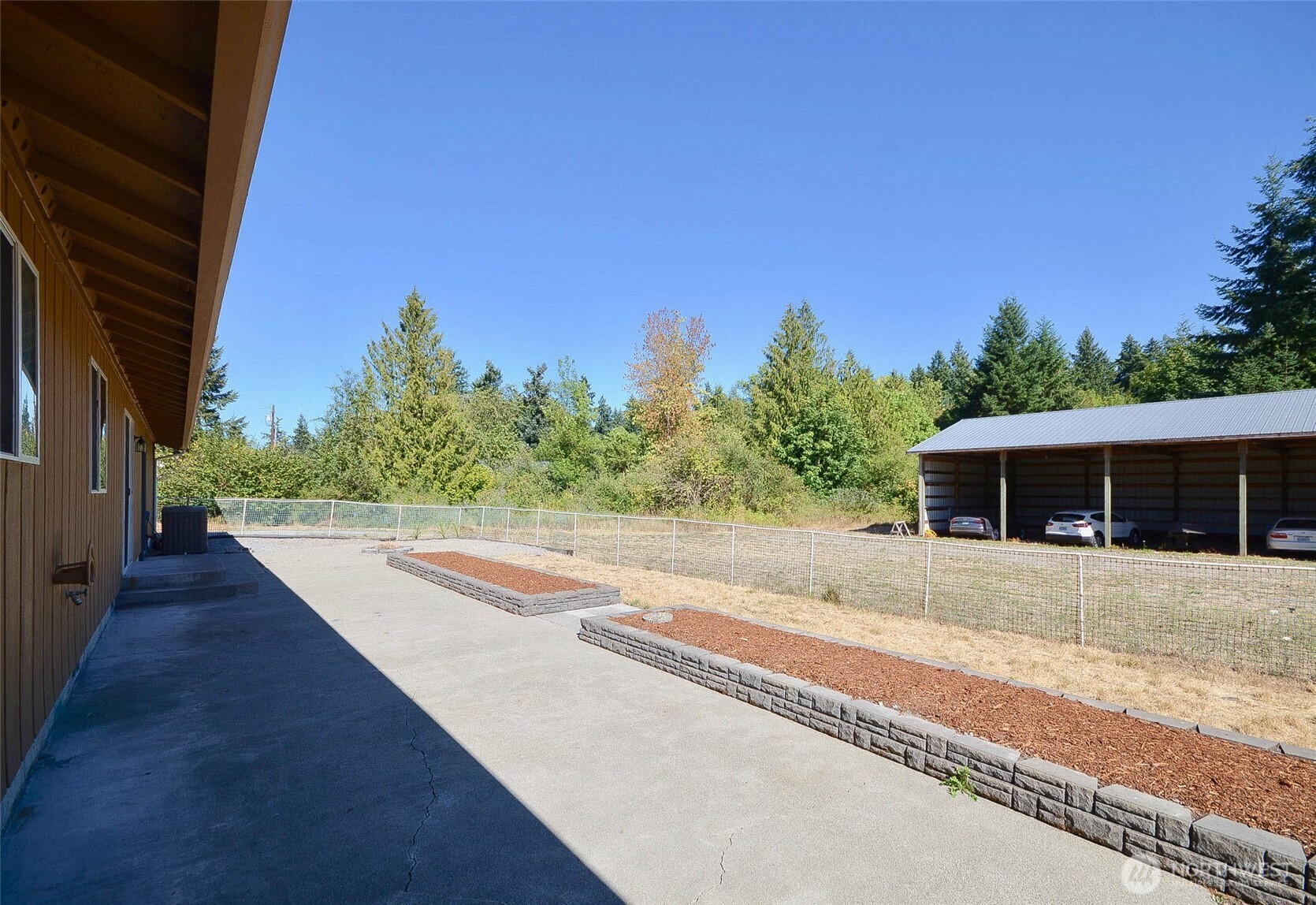 14638 Lawrence Lake Road Southeast Yelm, WA 98597 - Photo 31 of 38 a house with trees in the background