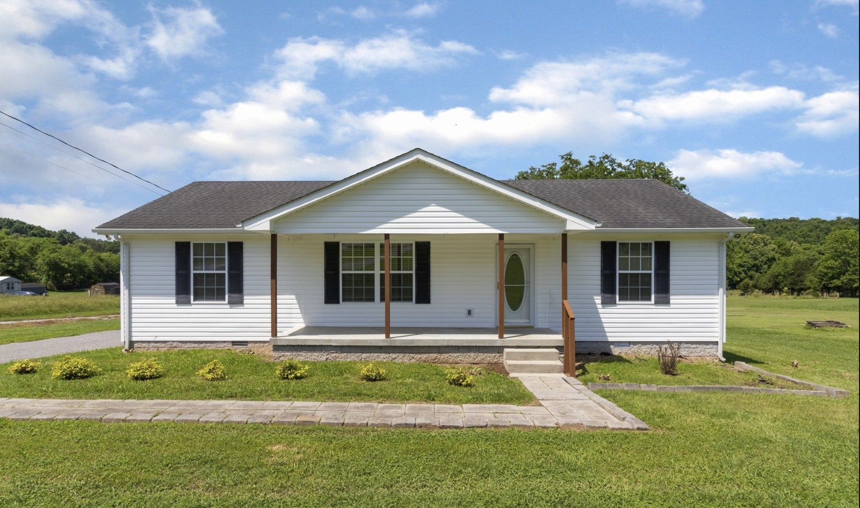 a front view of a house with a yard