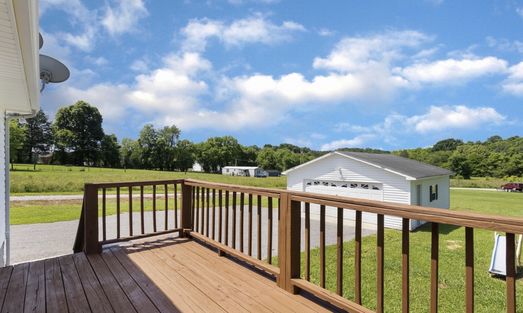 194 Opossum Hollow Road Watertown, TN 37184 - Photo 5 of 7 a view of a balcony with wooden floor & fence