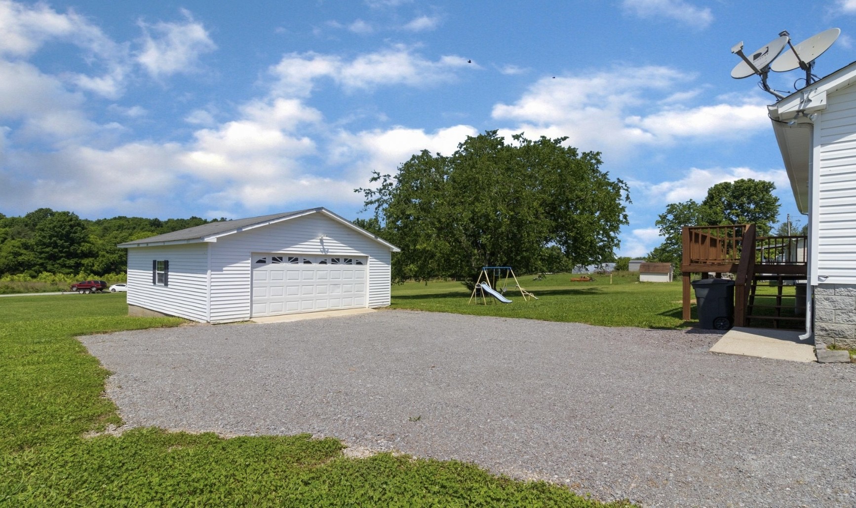 194 Opossum Hollow Road Watertown, TN 37184 - Photo 7 of 7 a house with green field in front of it