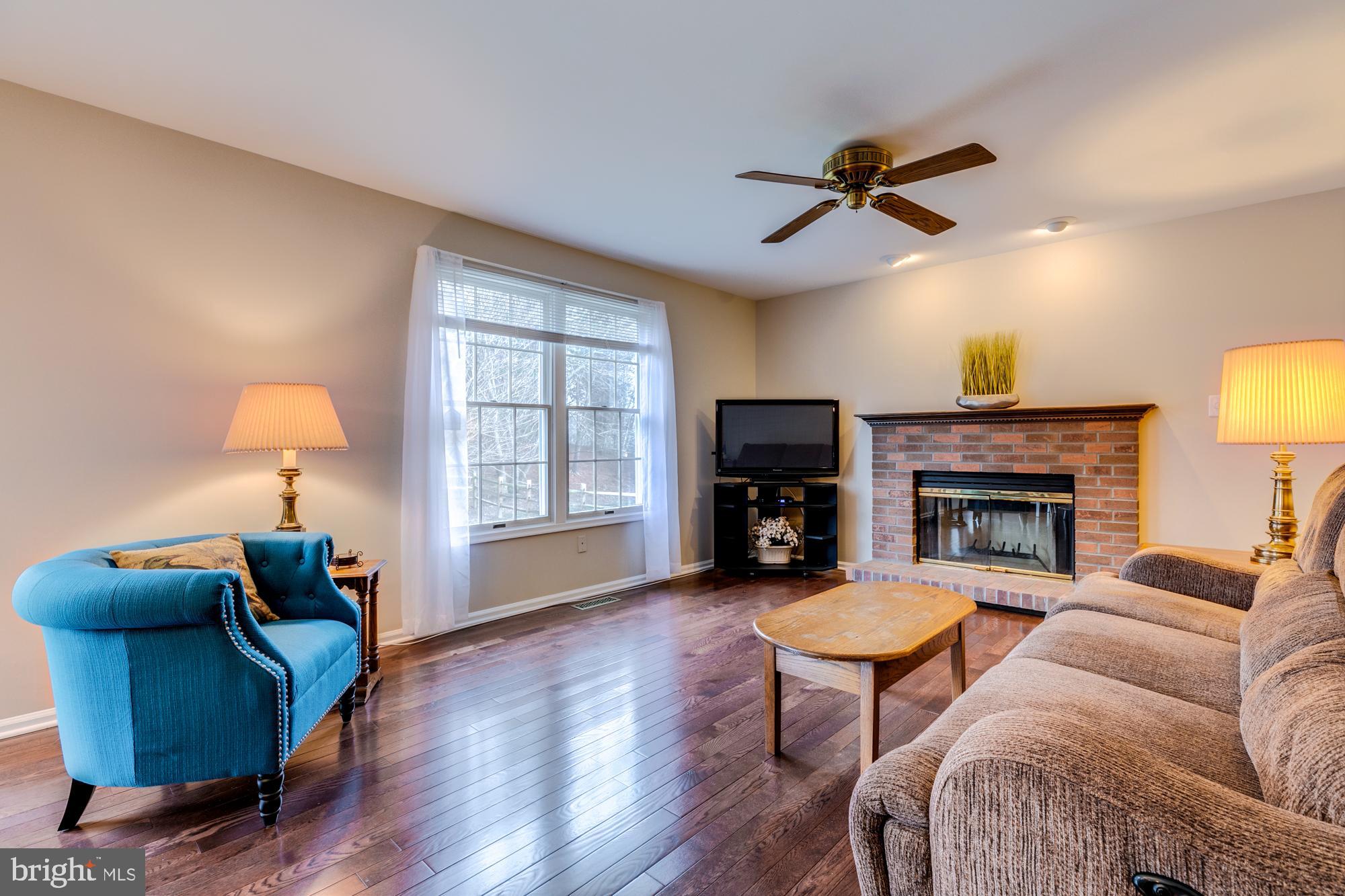 12553 Rock Ridge Road Herndon, VA 20170 - Photo 18 of 42 Family room with brick wood burning fireplace