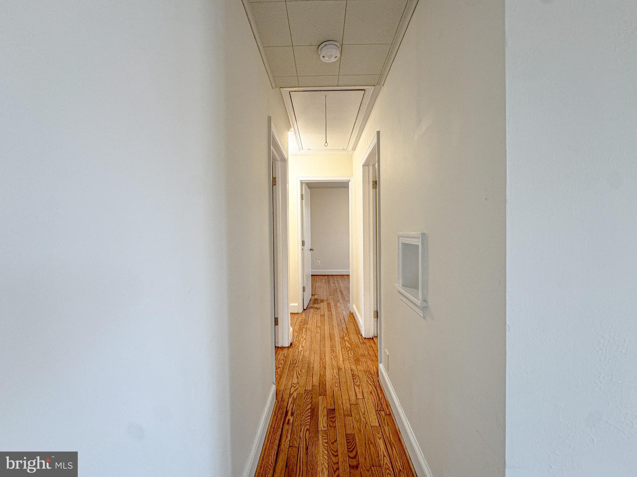10 Blair Road Fredericksburg, VA 22405 - Photo 4 of 15 a view of a hallway with wooden floor and a bathroom