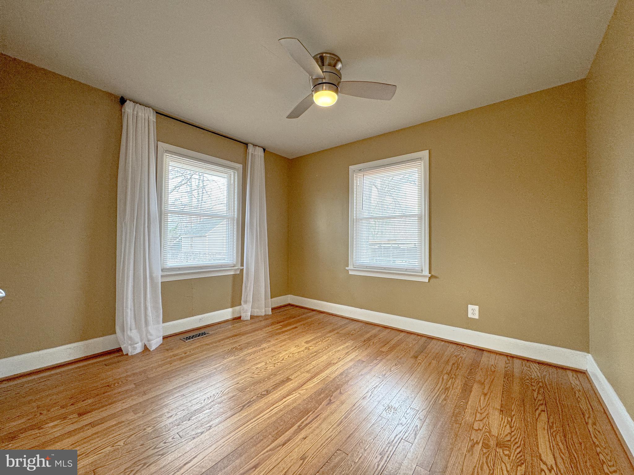 10 Blair Road Fredericksburg, VA 22405 - Photo 5 of 15 a view of an empty room with wooden floor and a window