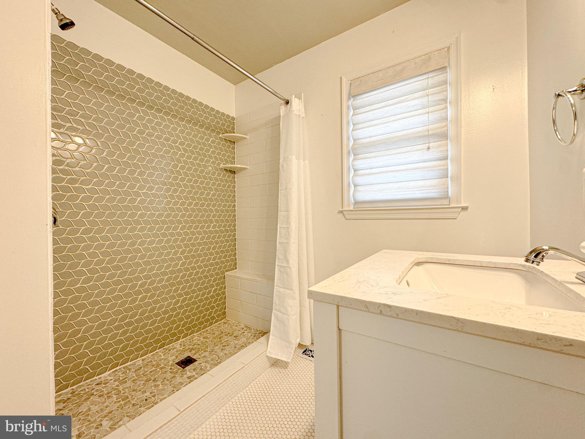 10 Blair Road Fredericksburg, VA 22405 - Photo 9 of 15 a bathroom with a tub shower and sink