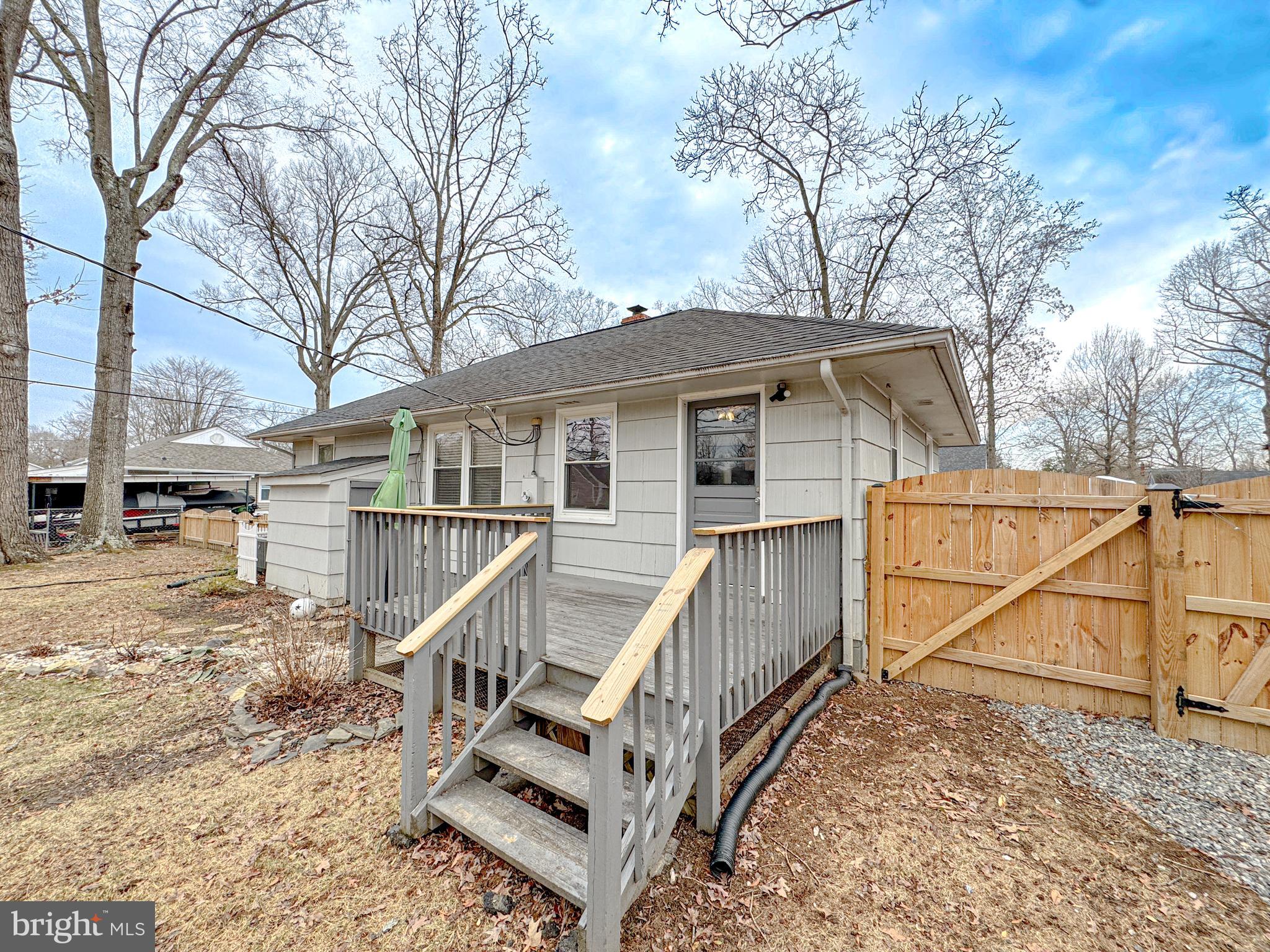 10 Blair Road Fredericksburg, VA 22405 - Photo 10 of 15 a view of a house with a small yard and wooden deck
