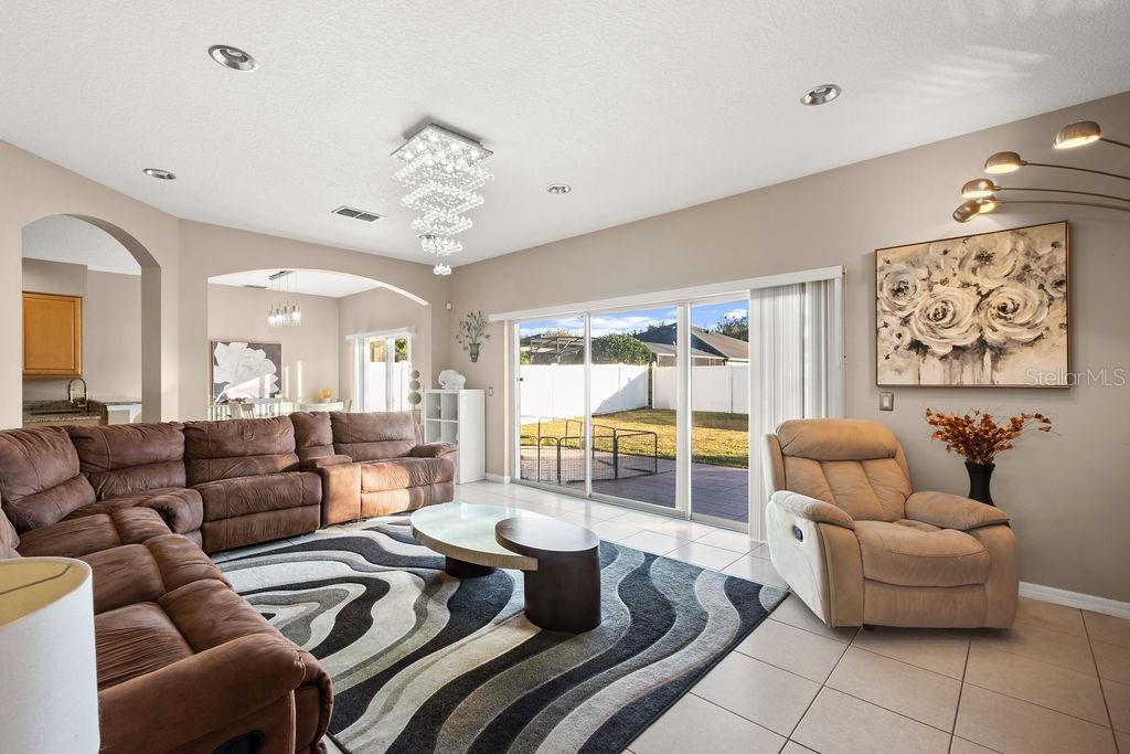1349 Castleport Road Winter Garden, FL 34787 - Photo 12 of 40 a living room with furniture and a large window