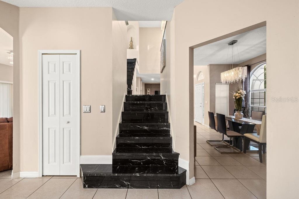 1349 Castleport Road Winter Garden, FL 34787 - Photo 21 of 40 a view of a hallway with living room and couch