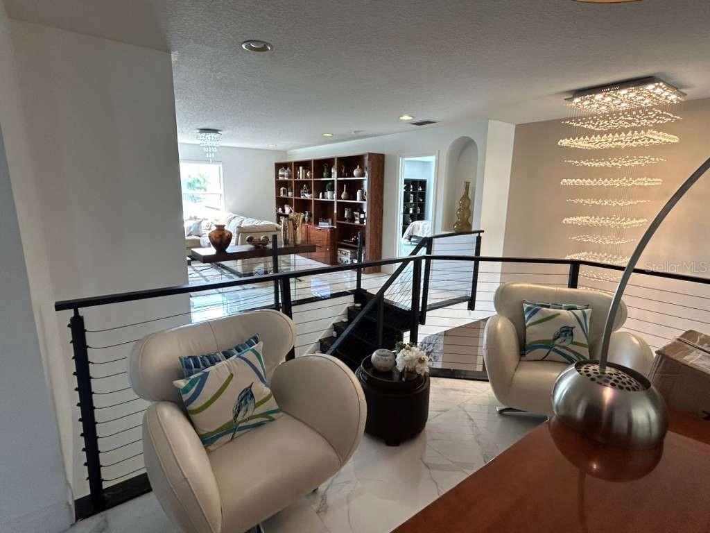 1349 Castleport Road Winter Garden, FL 34787 - Photo 24 of 40 a living room with furniture and hard wood flooring