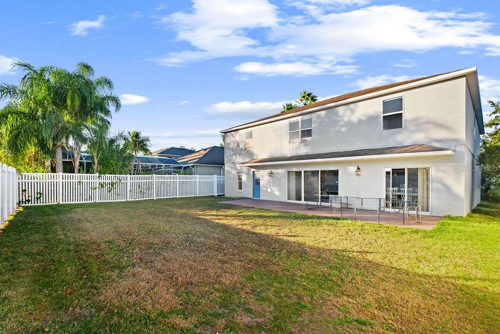 1349 Castleport Road Winter Garden, FL 34787 - Photo 3 of 40 a view of a house with a swimming pool and a yard