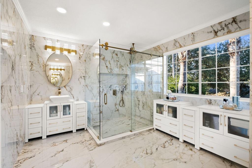 1349 Castleport Road Winter Garden, FL 34787 - Photo 32 of 40 a bathroom with a double vanity sink mirror and shower
