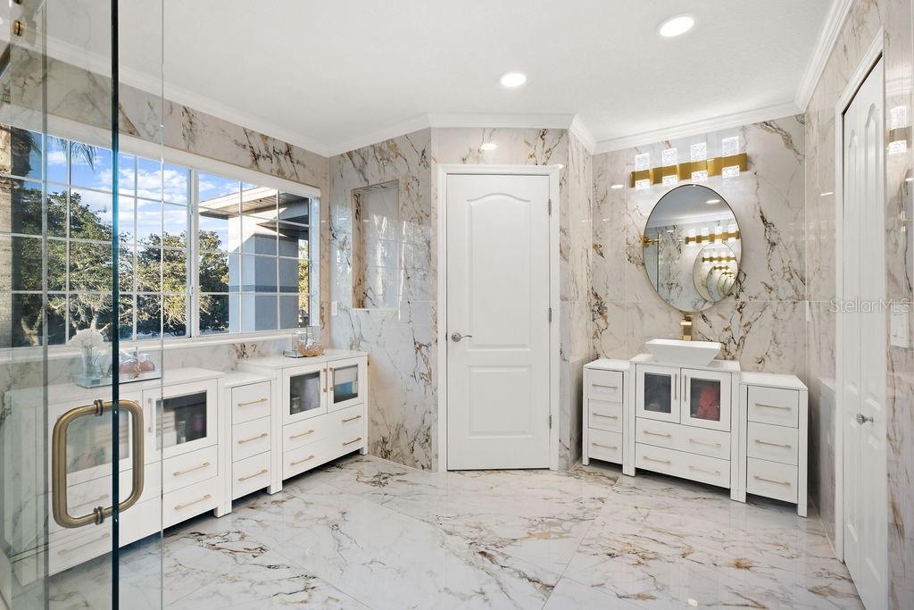 1349 Castleport Road Winter Garden, FL 34787 - Photo 33 of 40 a view of a hallway with washer and dryer