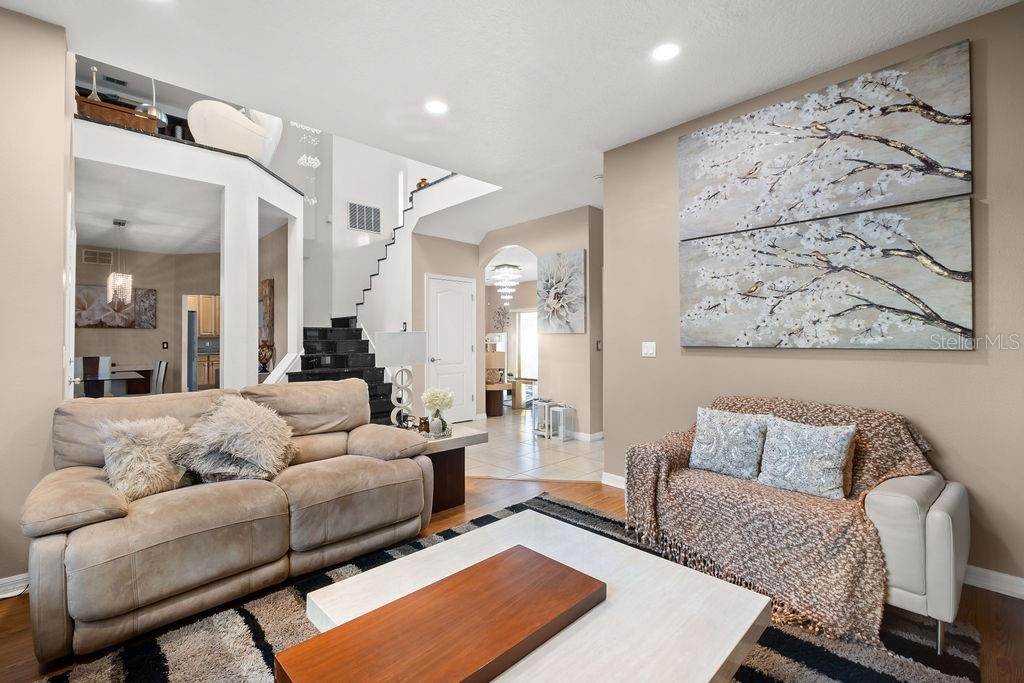 1349 Castleport Road Winter Garden, FL 34787 - Photo 7 of 40 a living room with furniture and a couch