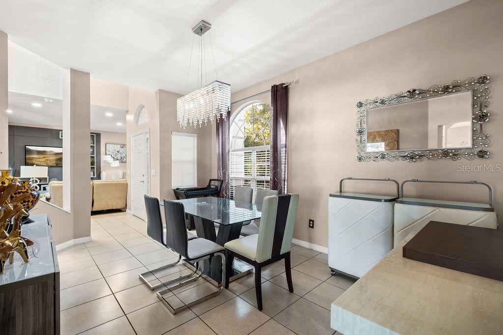 1349 Castleport Road Winter Garden, FL 34787 - Photo 9 of 40 a view of a dining room with furniture and a large window
