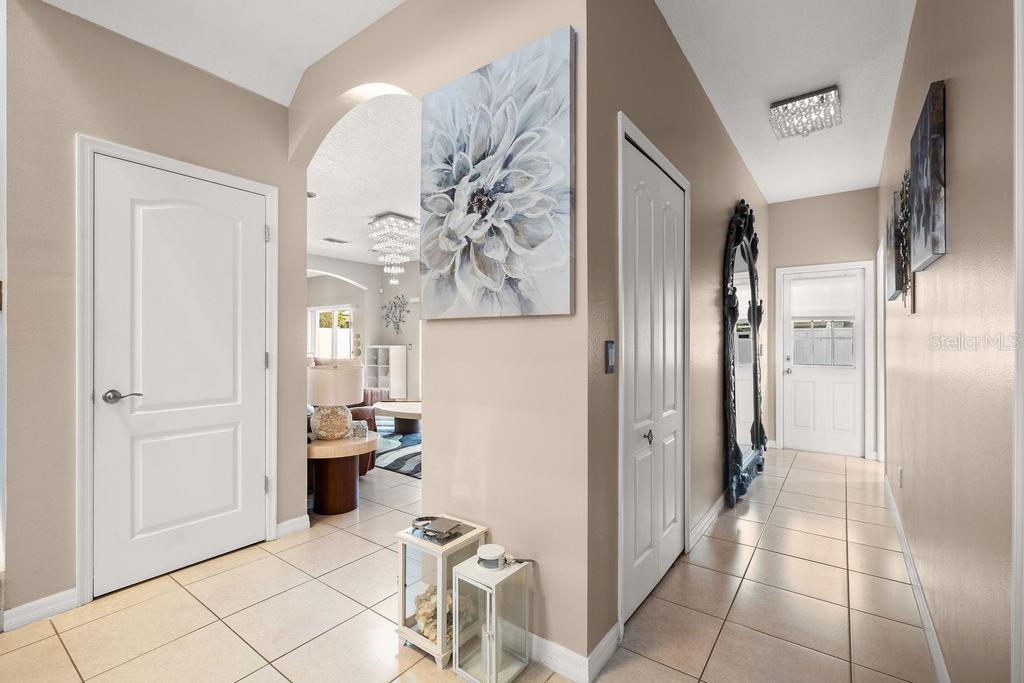 1349 Castleport Road Winter Garden, FL 34787 - Photo 10 of 40 a room with stainless steel appliances a refrigerator and a view of living room