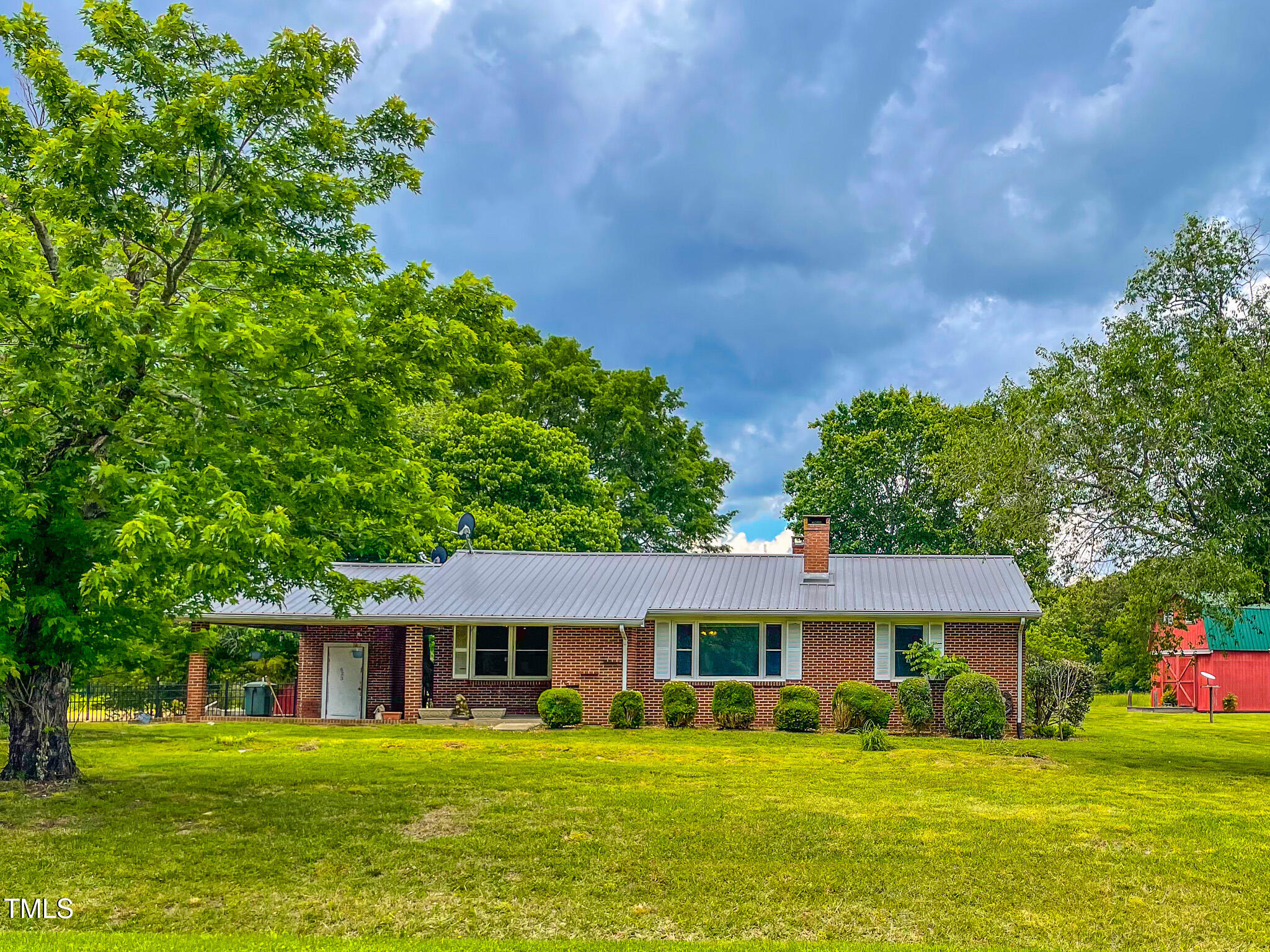 623 Chambers Road Rougemont, NC 27572 - Photo 13 of 44 a front view of a house with a garden