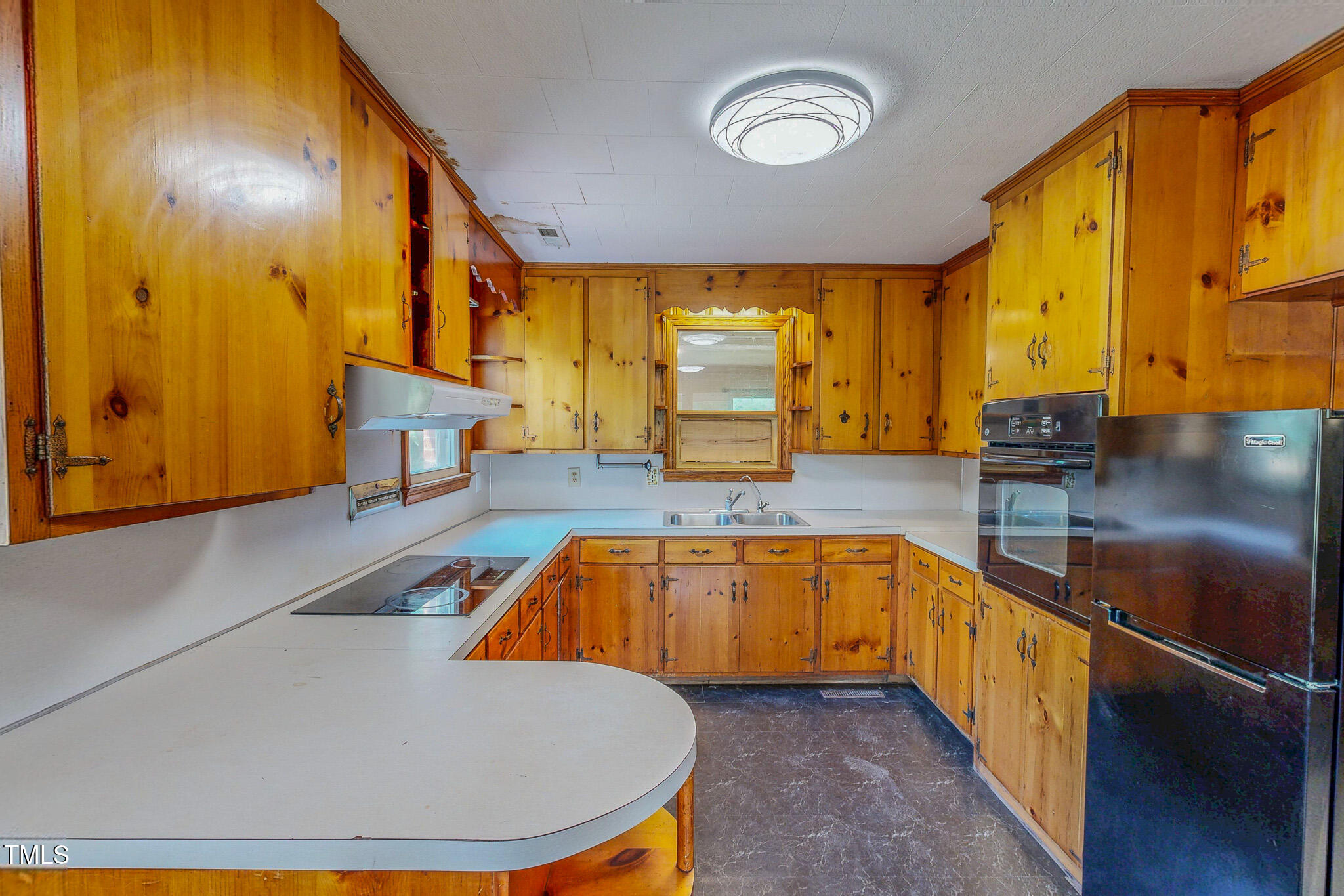 623 Chambers Road Rougemont, NC 27572 - Photo 23 of 44 a kitchen with stainless steel appliances granite countertop a sink a stove and a refrigerator