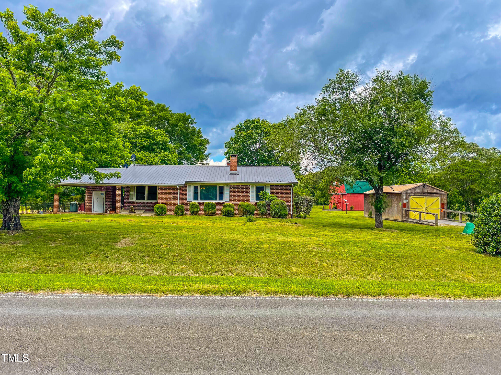 623 Chambers Road Rougemont, NC 27572 - Photo 31 of 44 a front view of a house with a garden