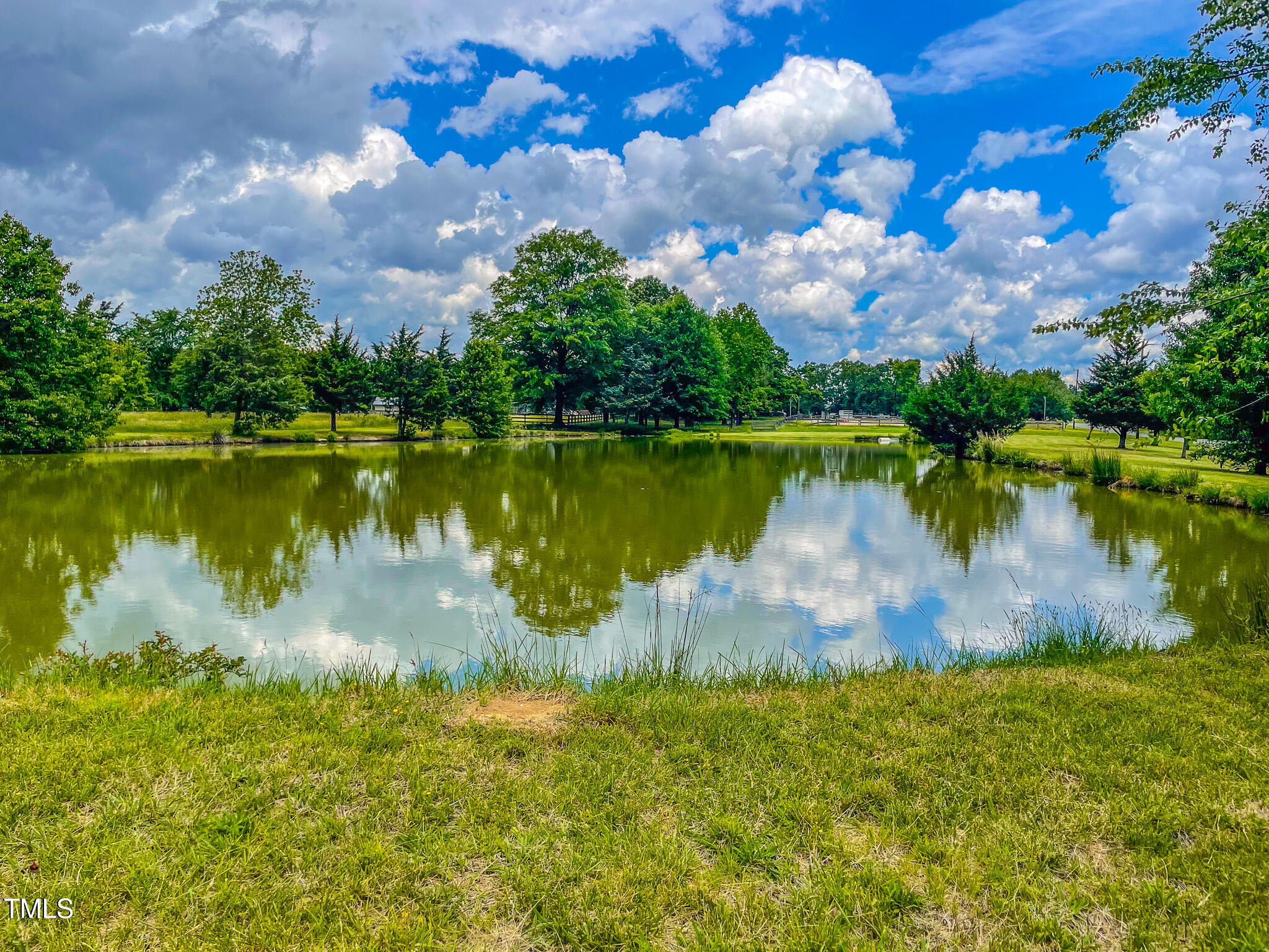 623 Chambers Road Rougemont, NC 27572 - Photo 6 of 44 a view of a lake with houses in the back