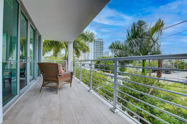 a view of balcony with furniture