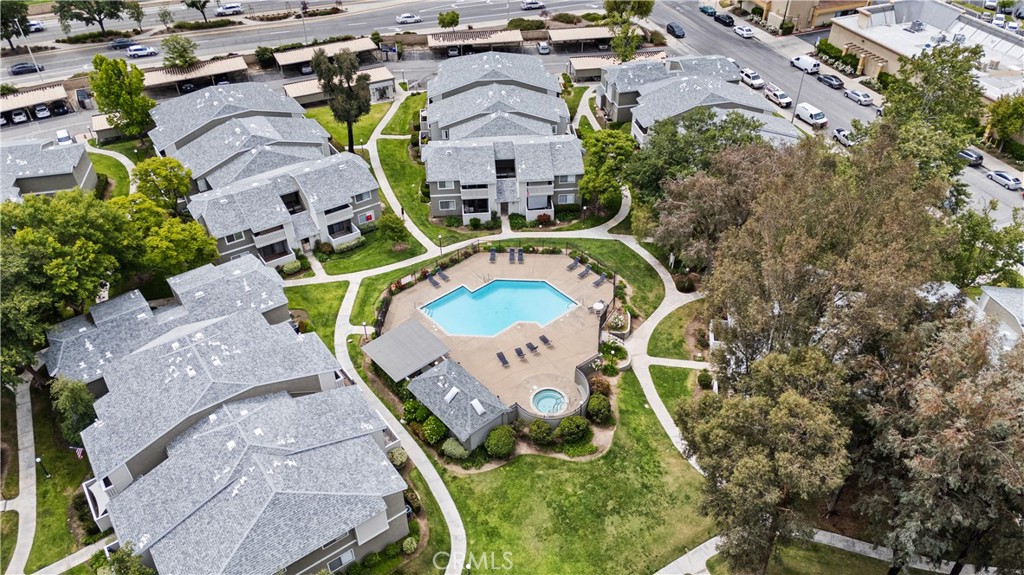 27645 Susan Beth Way, Unit A Saugus, CA 91350 - Photo 25 of 26 an aerial view of a house with outdoor space and a large pool