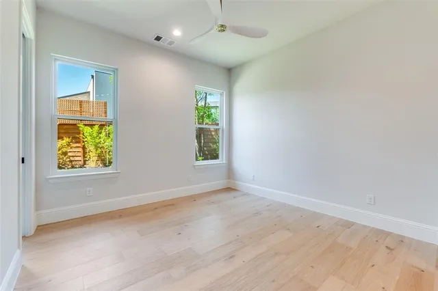 a bathroom with a double vanity sink tub and mirror