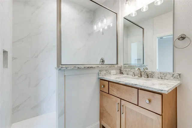 a view of empty room with ceiling fan